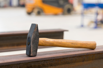 Old hammer on working place