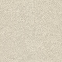 Creamy, beige, light leather background. Vintage fashion background for designers and composing collages. Luxury textured genuine leather of high quality.