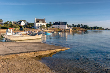 Fototapeta na wymiar French landscape - Bretagne. A small fishing village in a beautiful bay after sunrise.