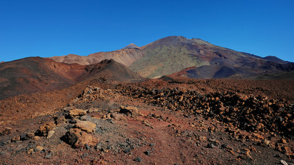 Volcanic landscape with lava Aa at Montana Samara hike, one of the most unusual alien-like environment found at Teide National Park, with views towards Pico del Teide, Pico Viejo and Las Cuevas Negras