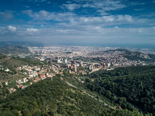 Fototapeta na wymiar A postcard aerial view of Barcelona from the Tibidabo hills at sunny summer day 2