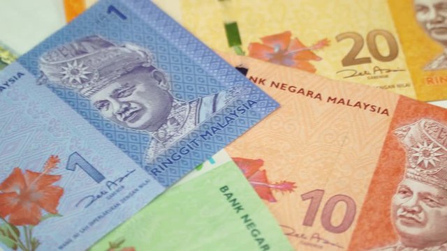 Malaysia money on rotating table. 4K