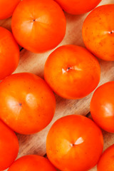 Fresh ripe persimmons in market. Persimmons background.