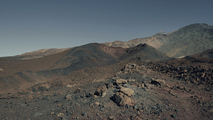 Futuristic color effect of the volcanic landscape of Pico del Teide and Pico Viejo, in Teide National Park, concept for alien and life origin, environmental impact of the elements or life extinction