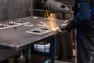 Surface grinding on steel workpiece