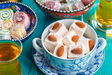 various pieces of turkish delight lokum and black tea