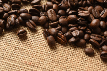 Closeup of coffee beans on burlap background