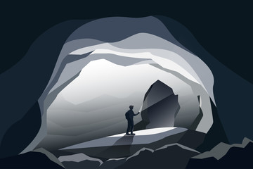 caves landscape and man standing wiht flashlight - obrazy, fototapety, plakaty