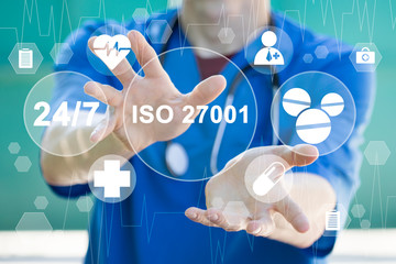 Doctor clicks iso 27001 word i surrounded by specific words. Information healthcare. International...