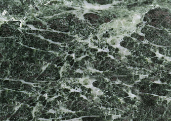 Textured grey marble stone with white streaks