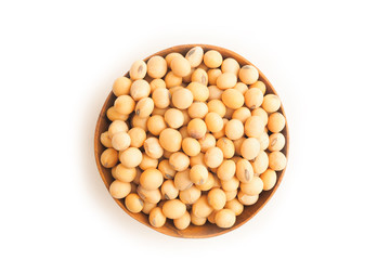 Soybeans on wooden bowl on white background