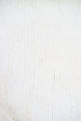 Wooden background of old fence with rusty nails. Shabby texture of white colored wooden boards.