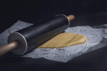 Delicious homemade sweet dough shaped with rolling pin. Horizontal