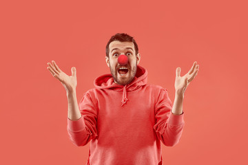 The happy surprised and smiling man on red nose day. The clown, fun, party, celebration, funny,...
