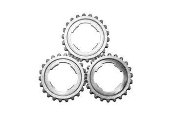 A large group of individual metal gears isolated on a white background