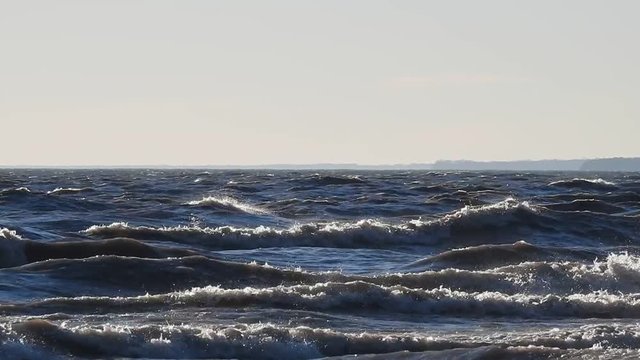 Ocean Waves Against Clearn Light Blue Sky Background