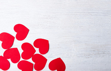 red heart paper cut on white wooden background.Image of Valentines day