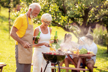 Senior couple make barbecue