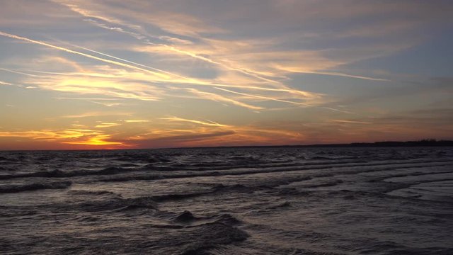 4K Ocean Sunset Beach Pan Left To Right With People Walking On Beach