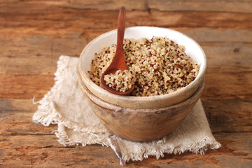 Cooked quinoa in a wooden bowl