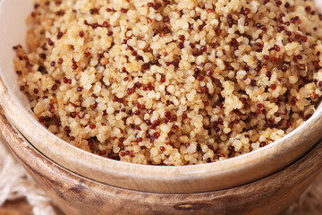 Cooked quinoa in a wooden bowl