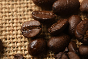 Closeup of coffee beans on burlap background