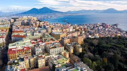 Poster Aerial view of Naples from the Vomero district. You can see Castel Sant'elmo in the foreground while in the background the city's port, the Vesuvius and the Ovo castle. There are houses and buildings. © Stefano Tammaro