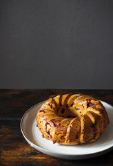 Homemade cake on rustic wooden background.