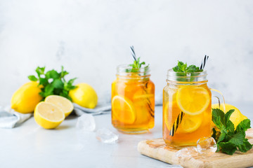 Fototapeta premium Lemon mint iced tea cocktail refreshing drink for summer days