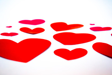 Red hearts on white background