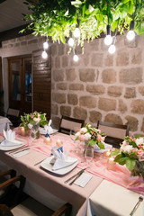table set and decorated with flowers for a wedding dinner
