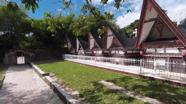 View of the traditional Batak graves, shaped like little houses on Samosir Island, Lake Toba, Sumatra, Indonesia.