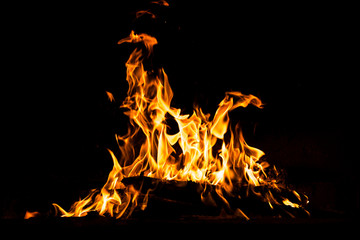 Fototapeta na wymiar Fire flames burning isolated on black background. High resolution wood fire flames collection smoke texture background concept image.