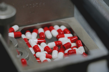 Drugs in Pharmaceutical machine close up