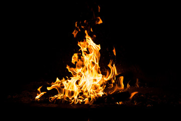Fire flames burning isolated on black background. High resolution wood fire flames collection smoke texture background concept image.
