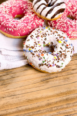 Sweet, delicious donuts on on rustic table - American donut