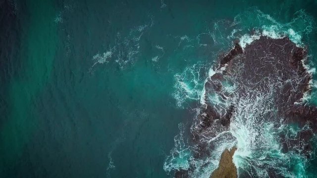 Top aerial view of Loch Ard Gorge beach in Twelve Apostles marine park on Shipwreck coast of Victoria, Australia.