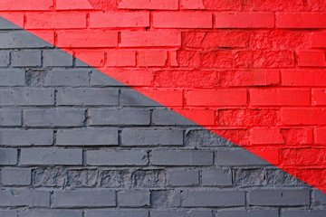 Colorful (grey and red) brick wall as background, texture