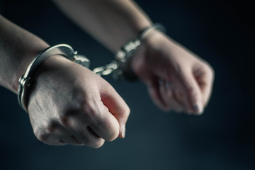 women handcuffed in criminal concept 