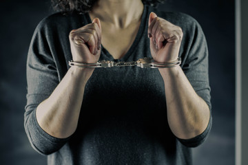 women handcuffed in criminal concept 