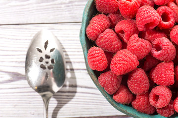 plate of fresh juicy raspberries