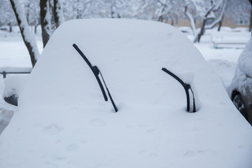 Machine, completely littered with snow