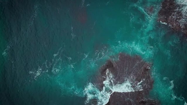 Top aerial view of Loch Ard Gorge beach in Twelve Apostles marine park on Shipwreck coast of Victoria, Australia.
