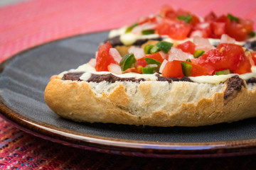 Molletes with Pico de Gallo, a Mexican Breakfast (Close-up)