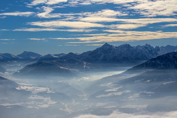 Fototapeta na wymiar Panorama of Innsbruck and the alps in Winter with cirrostratus clouds