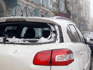 An icicle falling from the roof smashed the car's rear window. Close up