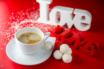 The theme of the lovers.Valentine's day. Coffee with sweets and inscriptions Love