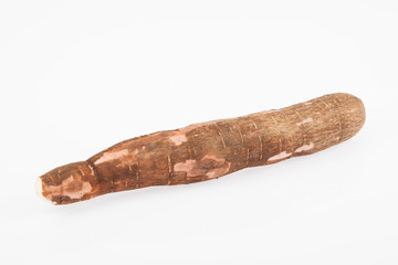 Raw yucca on white background-Manihot esculenta. (Cassava raw tuber)