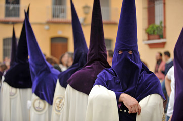 Nazarenes of the brotherhood of the Our Lady of Hope (Esperanza) of Triana. Procession of Holy Week (Semana Santa) in Seville. 
