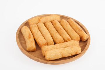 tasty fried yucca sticks on white background